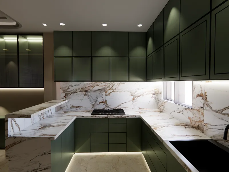 Premium modular kitchen design with marble countertop and dark green cabinets by ICreations Interior in New Town, Kolkata
